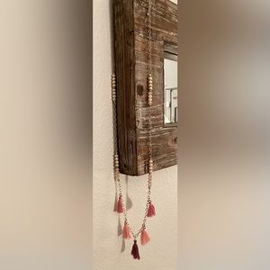 Gold tone, pink tassel necklace
